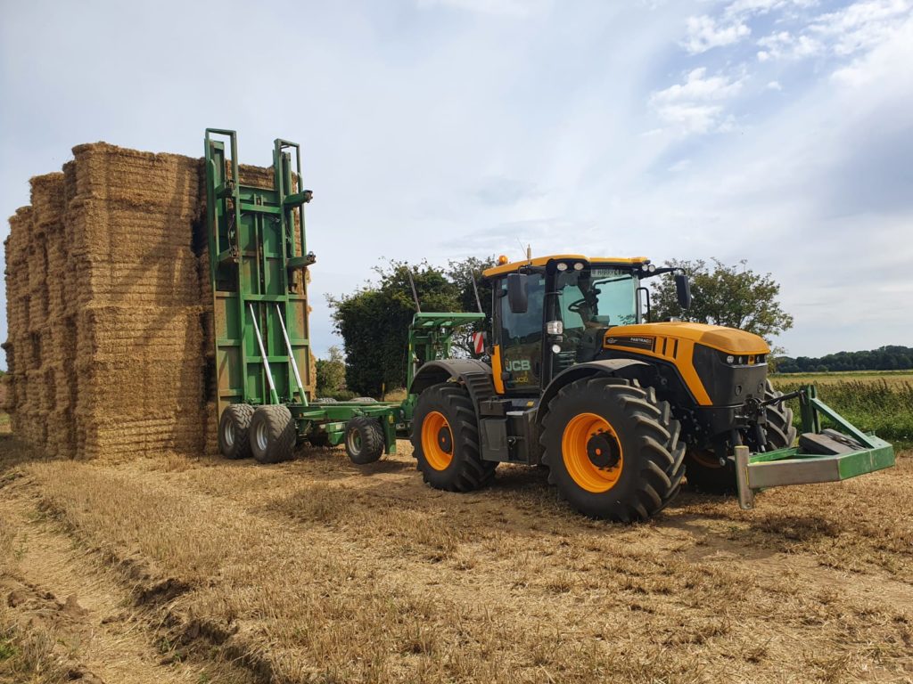 JCB Stacking 2nd load of bales with Trailer