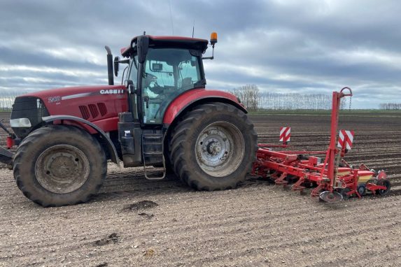 Red Glover tractor drilling for sugar beets